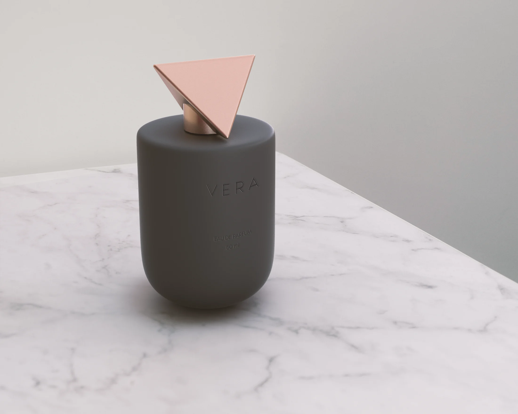 Vera perfume bottle with a rose gold cap on a marble surface